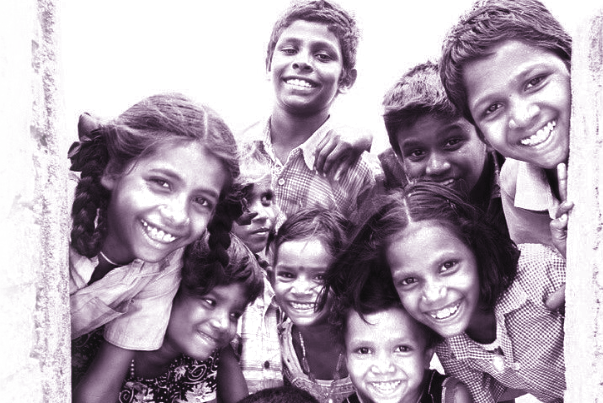 Children smiling at a community event